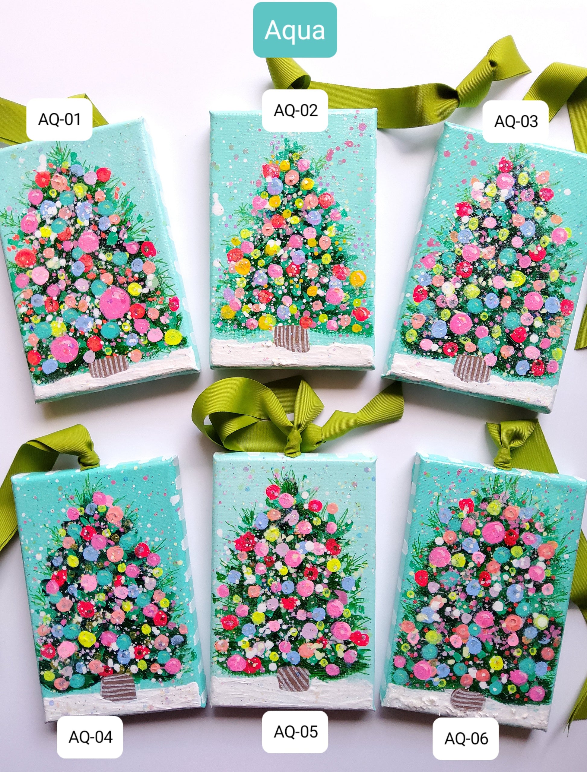 Set painted canvases with confetti like trees and green ribbons on a white background