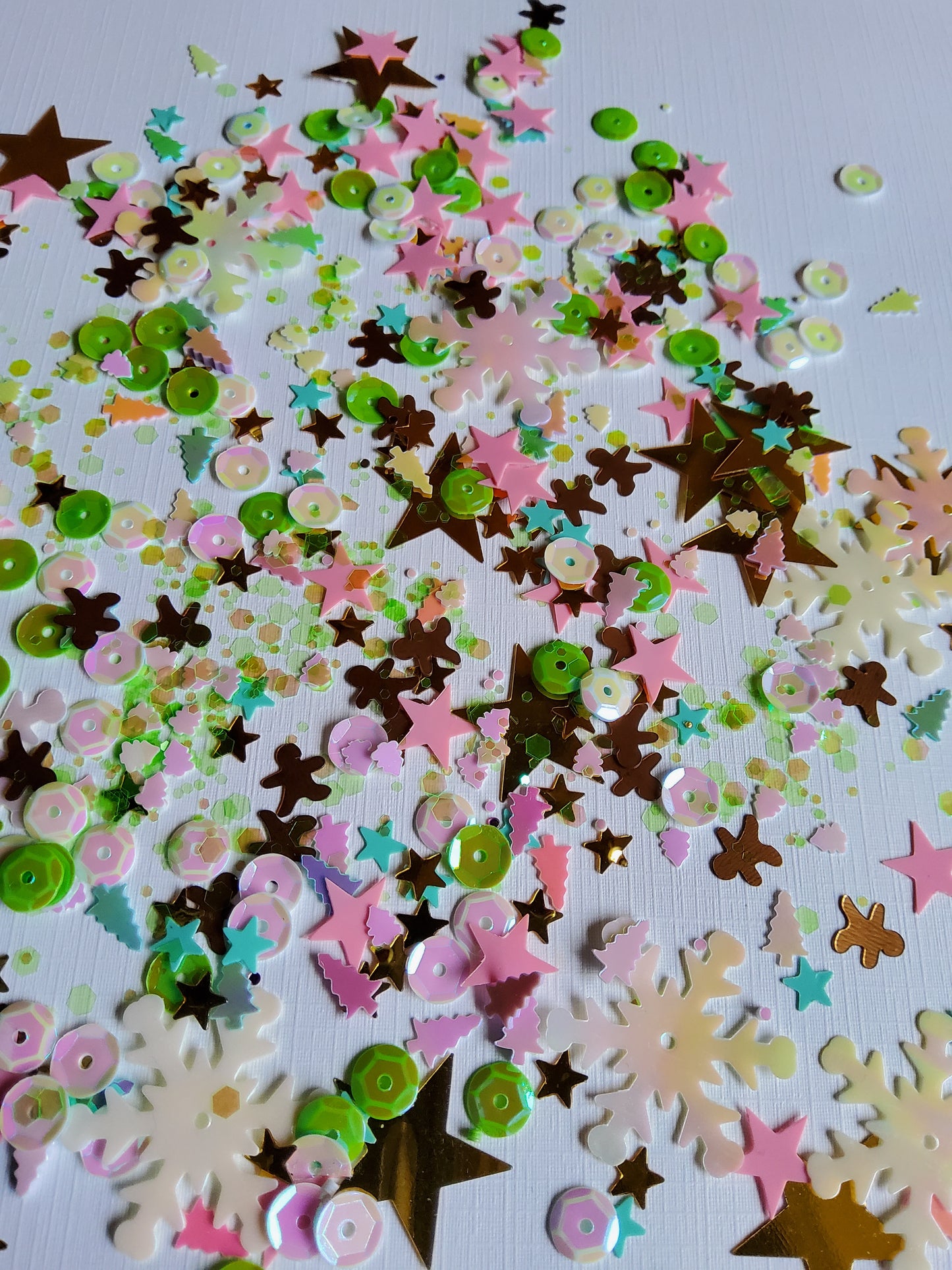 Colorful star-shaped confetti on a white background