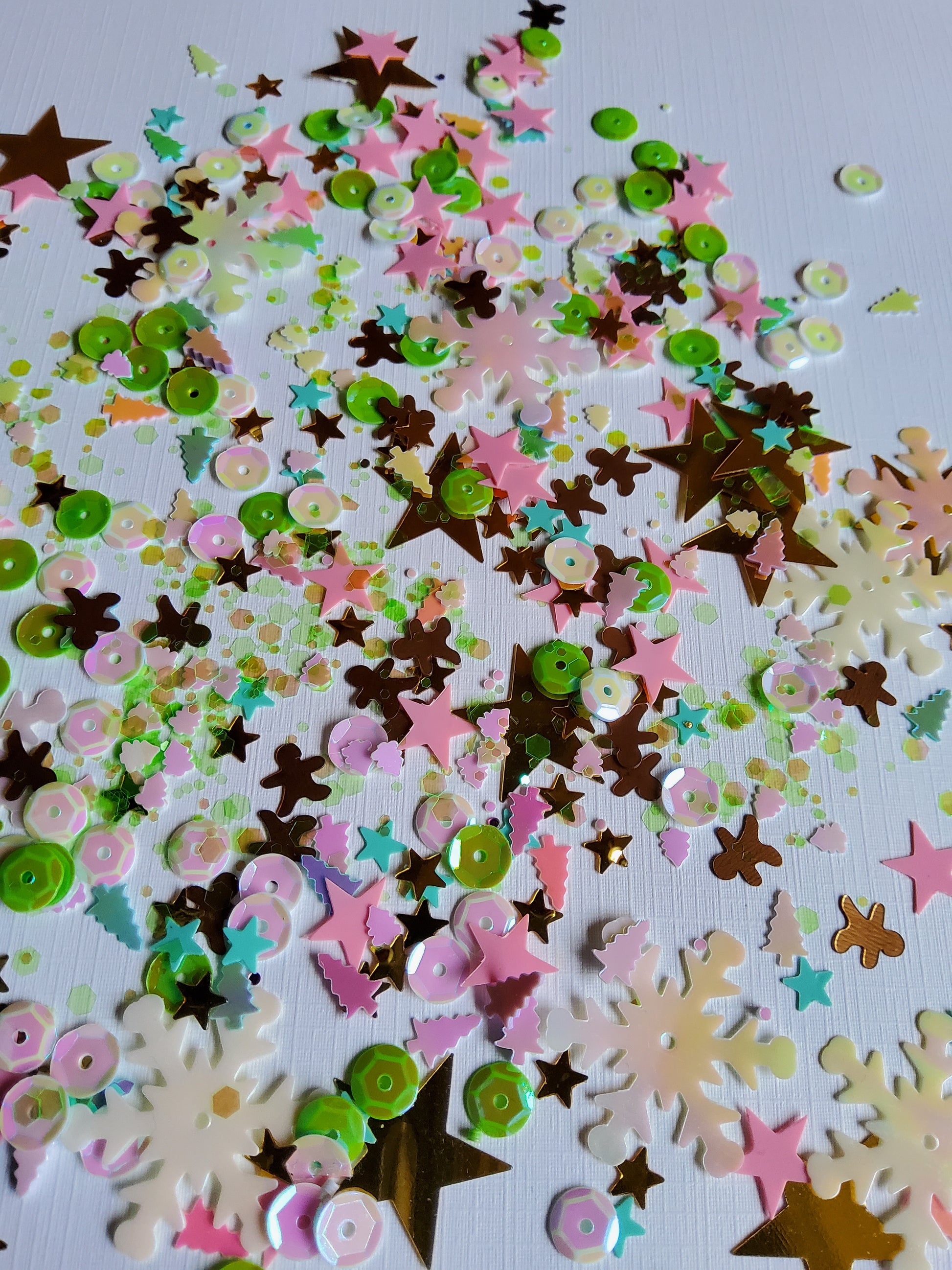 Colorful star-shaped confetti on a white background