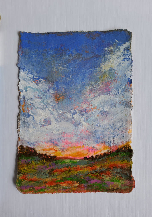 Vertical acrylic landscape with clouds, sunset tones, and deckle-edged handmade paper