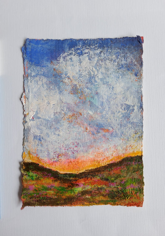 Vertical acrylic landscape with clouds, sunset tones, and deckle-edged handmade paper.